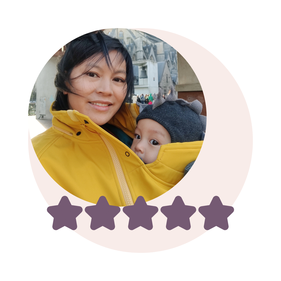 Mother with baby in circular photo wearing yellow babywearing jacket, five-star rating below