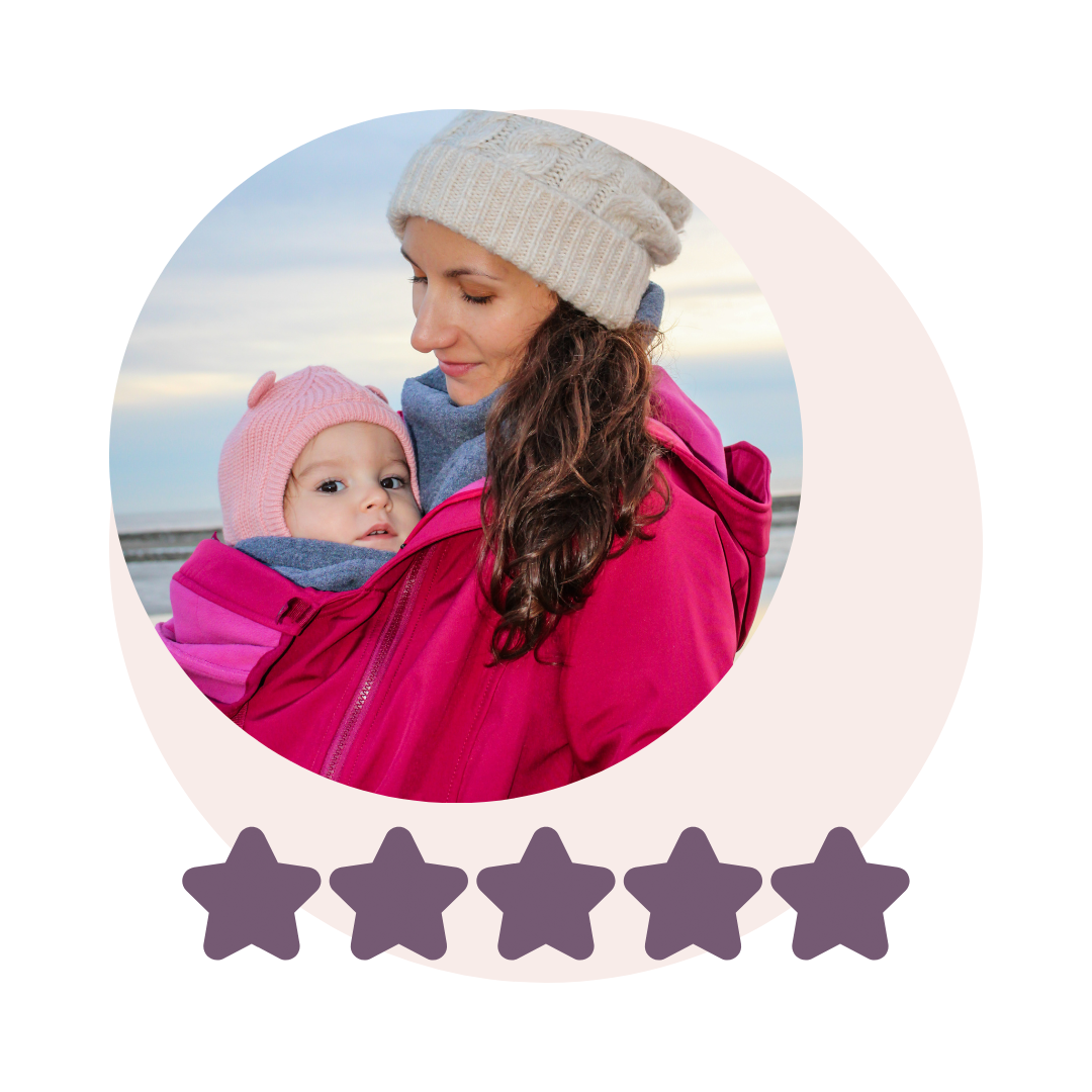 Mother with baby in pink softshell babywearing jacket, wearing beanie, five-star rating visible