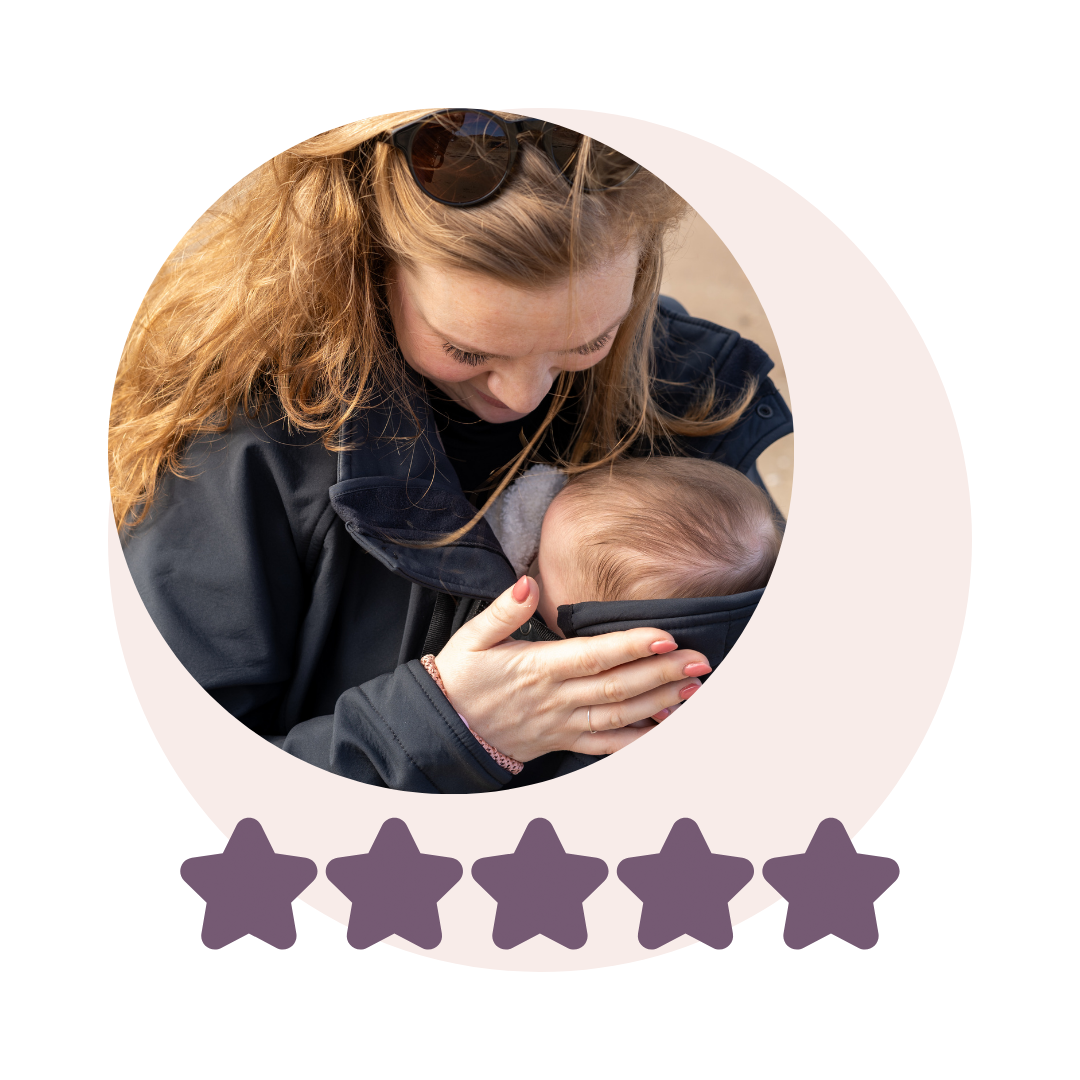 Mother carrying baby in softshell babywearing jacket, looking down lovingly, five-star rating visible
